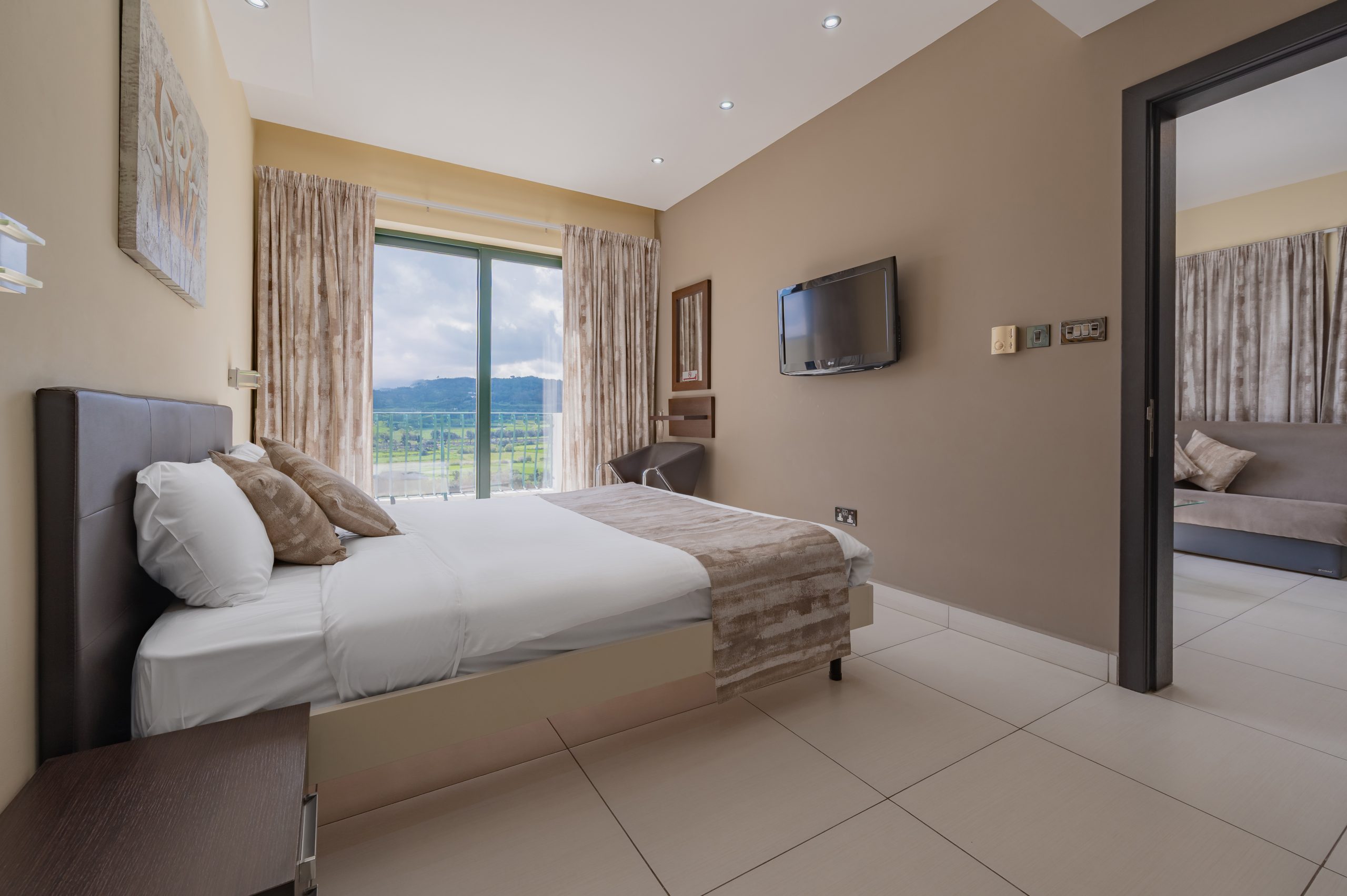 Penthouse suite with bed and sitting area